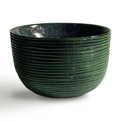 Sleek ceramic designer basin placed on a contemporary vanity counter.