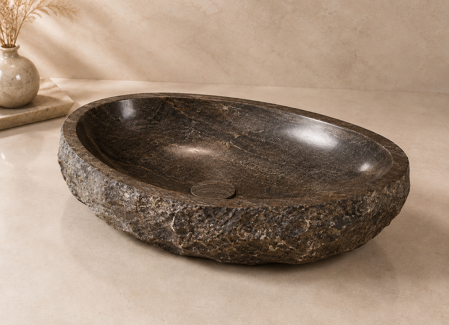 Luxury natural stone wash basin with handcrafted textured exterior, polished interior, and organic design for modern luxury bathrooms by CAROLIETO.